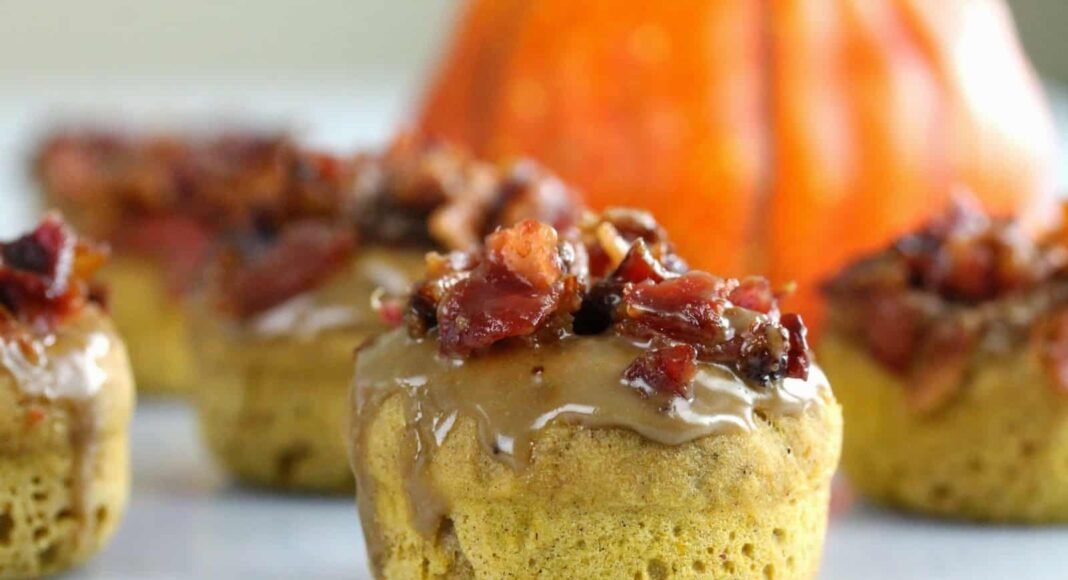 Maple Bacon Pumpkin Donut with a pumpkin in the background.