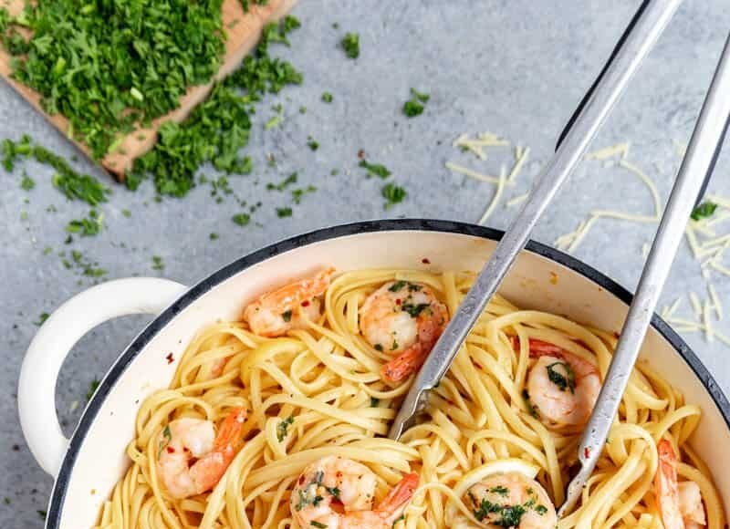 Looking into a large pot filled with shrimp linguine.
