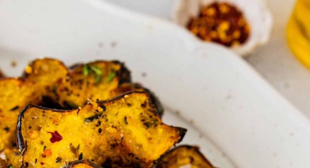 Roasted acorn squash served on a white plater.