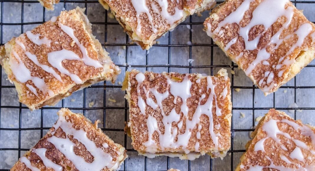 Pie bars with glaze drizzle on top.