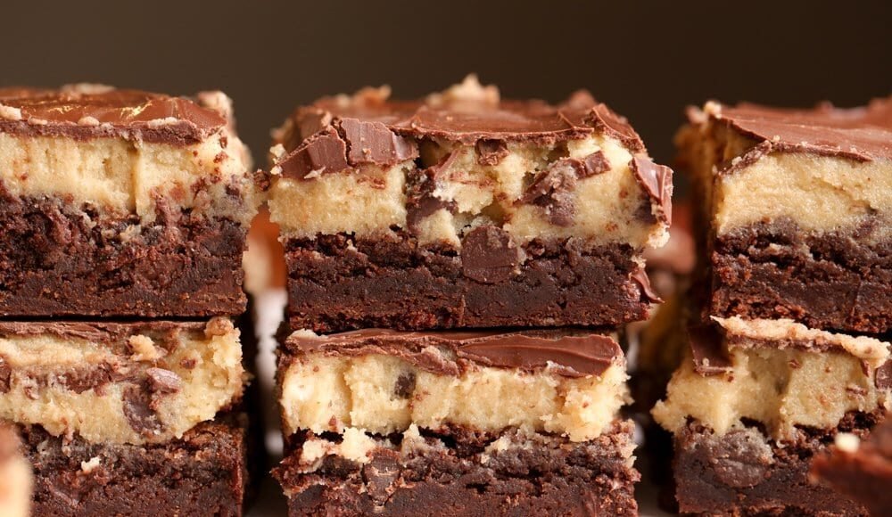 Fudge Brownies topped with raw cookie dough and chocolate ganache