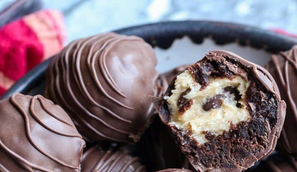 Brownie truffle filled with cookie dough broekn in half