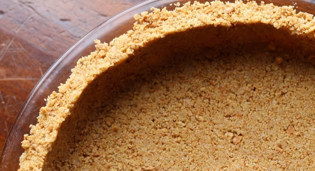 Graham cracker pie crust in a pie pan.