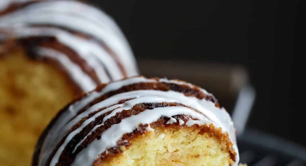 Slice of vanilla cake with vanilla icing.