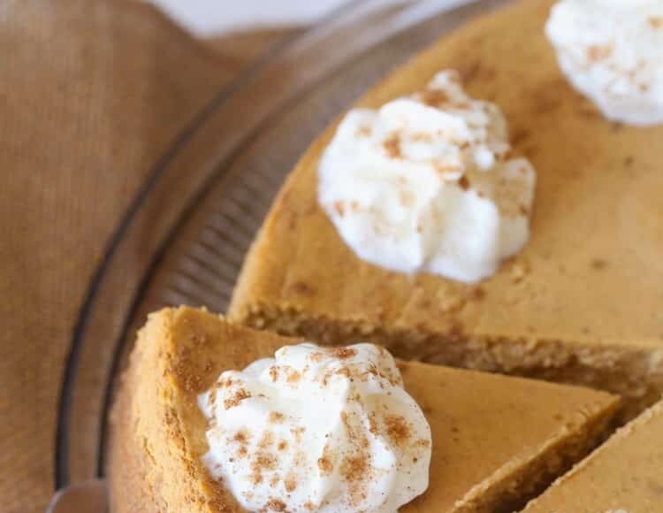 Sliced Pumpkin Cheesecake with whipped cream