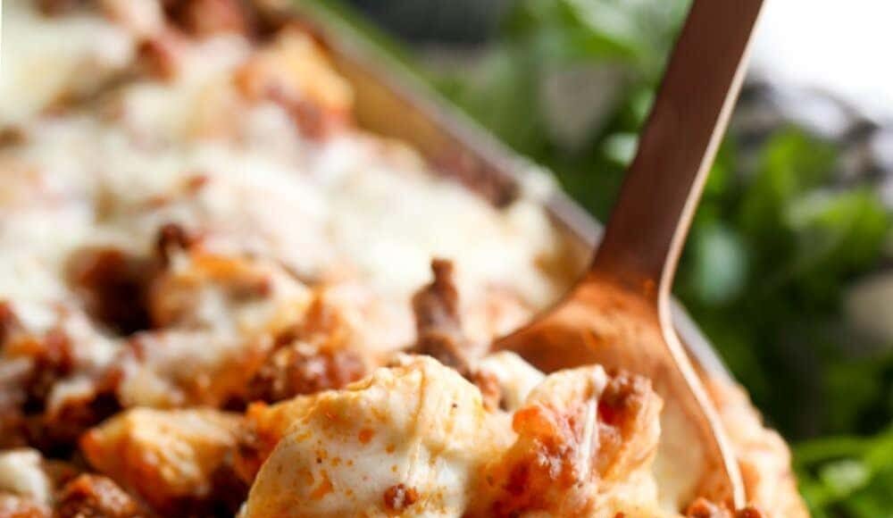 Unstuffed Shells pasta casserole with a spoon and melty cheese