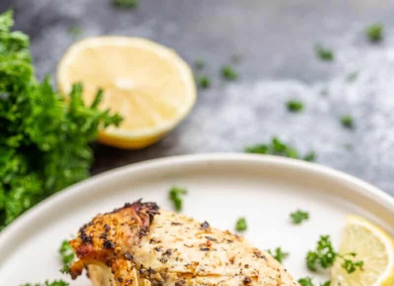 Air fried chicken breast on a dinner plate.