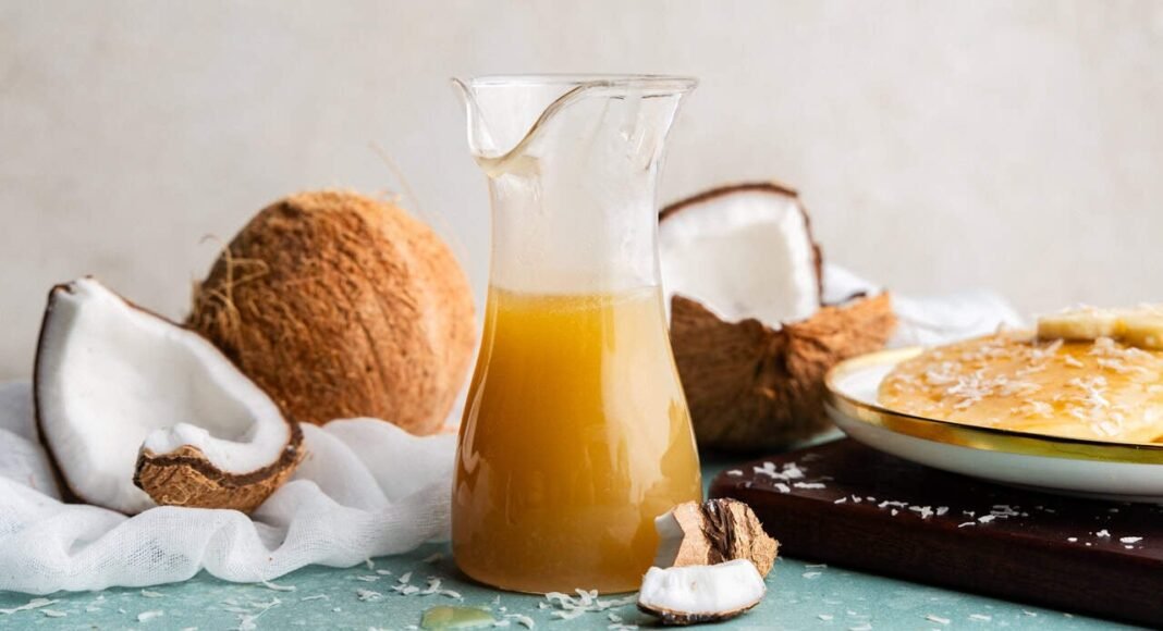 Coconut syrup in a pitcher.