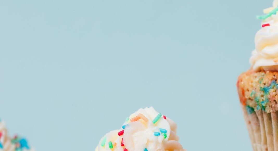 Photo showing the fluffy texture of the inside of our gluten-free funfetti cupcakes